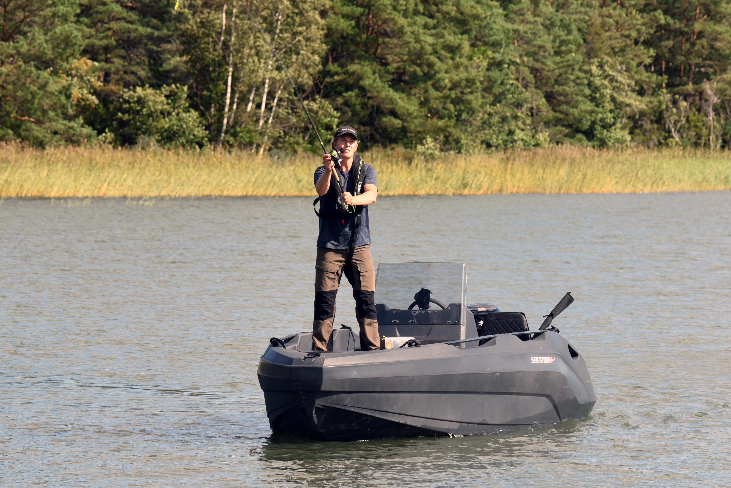 a man fishing on a seastorm boat